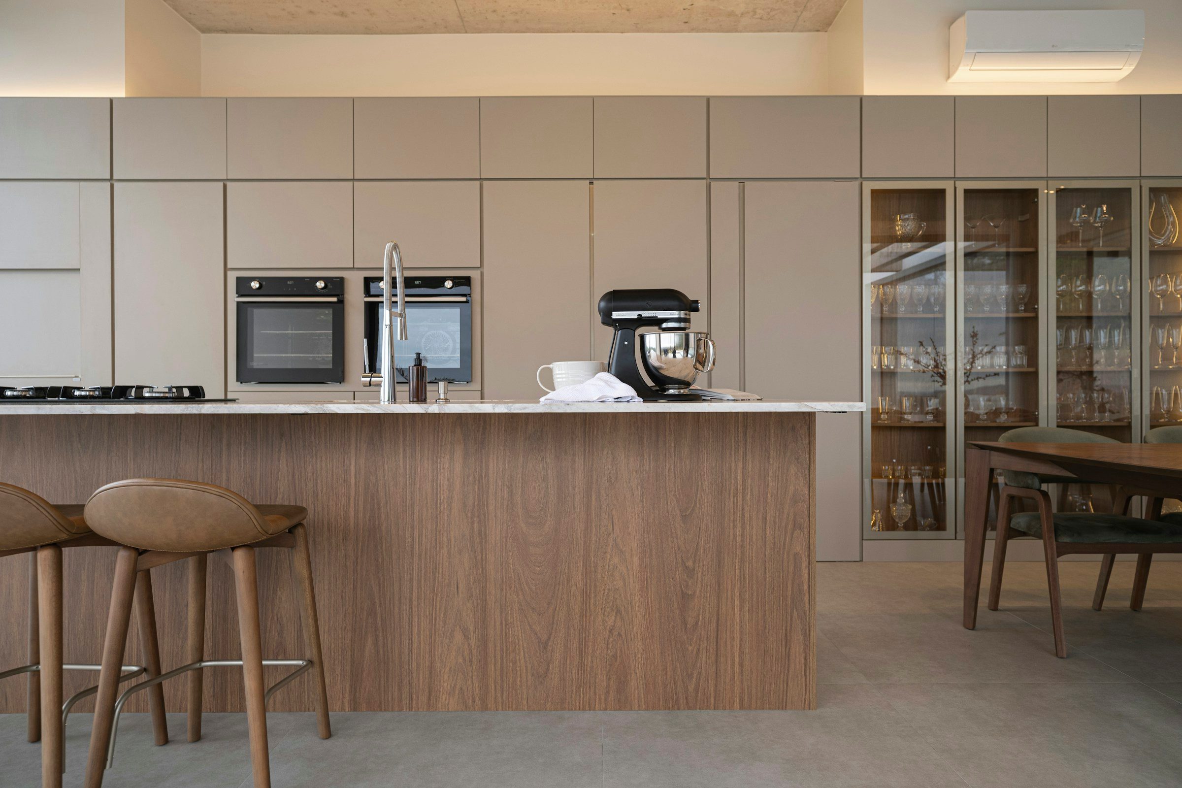 Walnut kitchen with tall units, example image