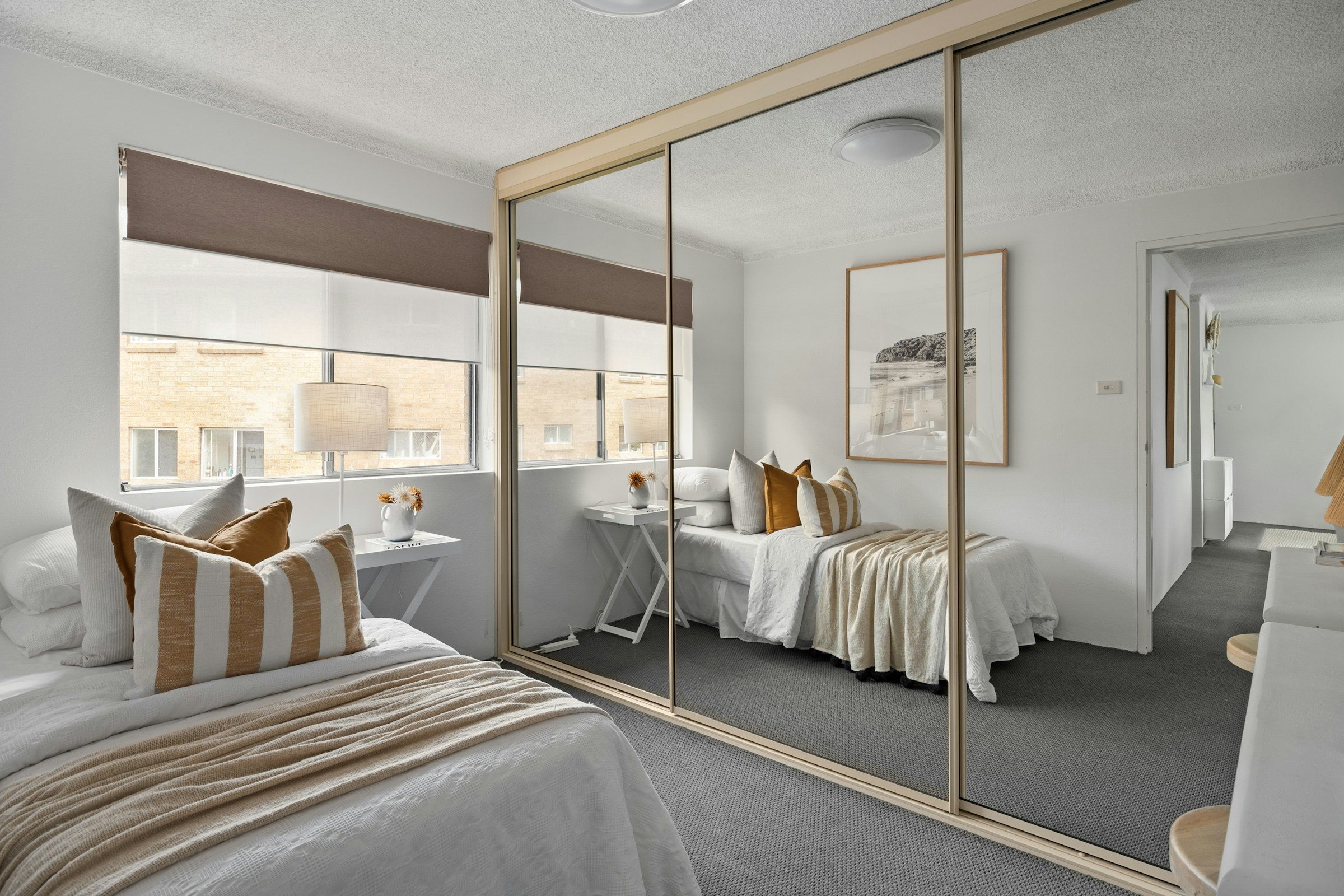 Fitted wardrobe with sliding mirror doors, example image